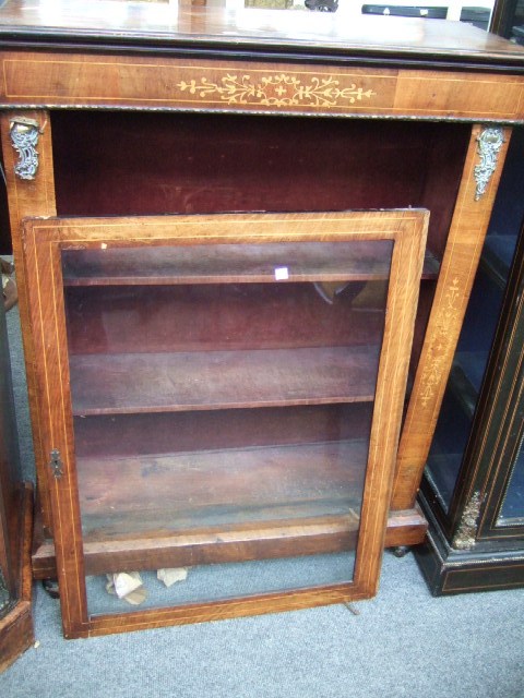 Appraisal: A Victorian walnut and gilt metal mounted floor standing open