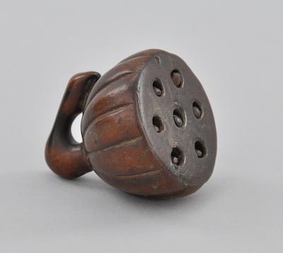 Appraisal: A Carved Wood Pod Shape Netsuke In the form of