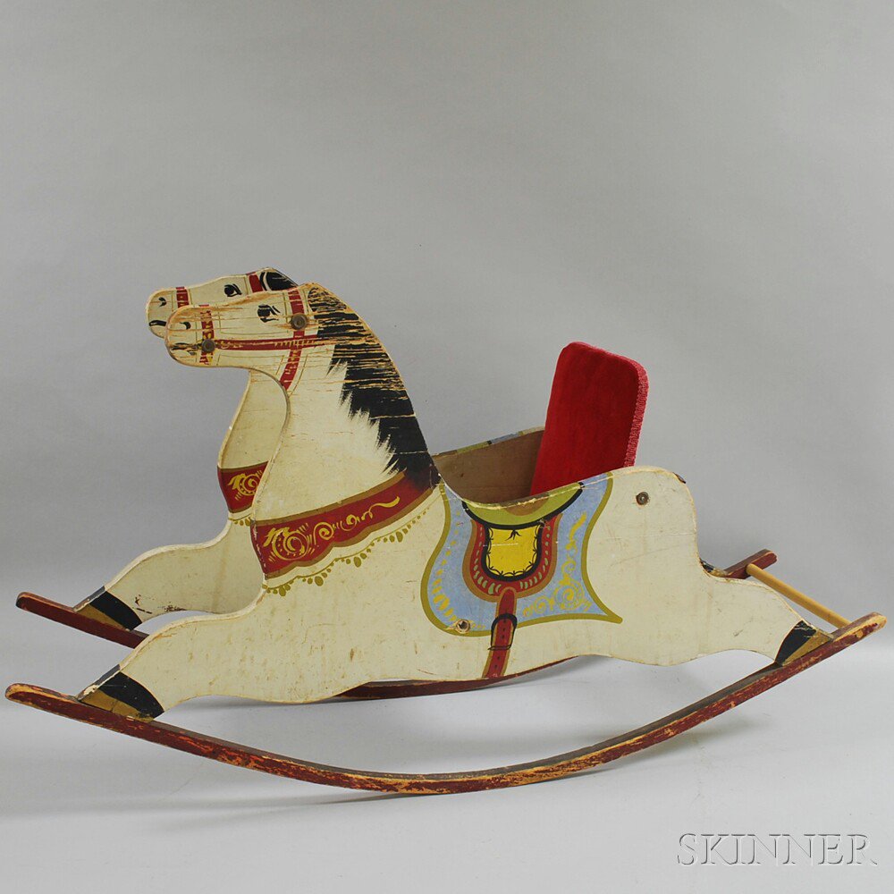 Appraisal: Paint-decorated Child's Rocking Horse with red velvet seat brown-painted hand