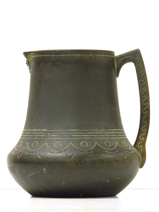 Appraisal: Norse art pottery ceramic pitcher black ground with light green