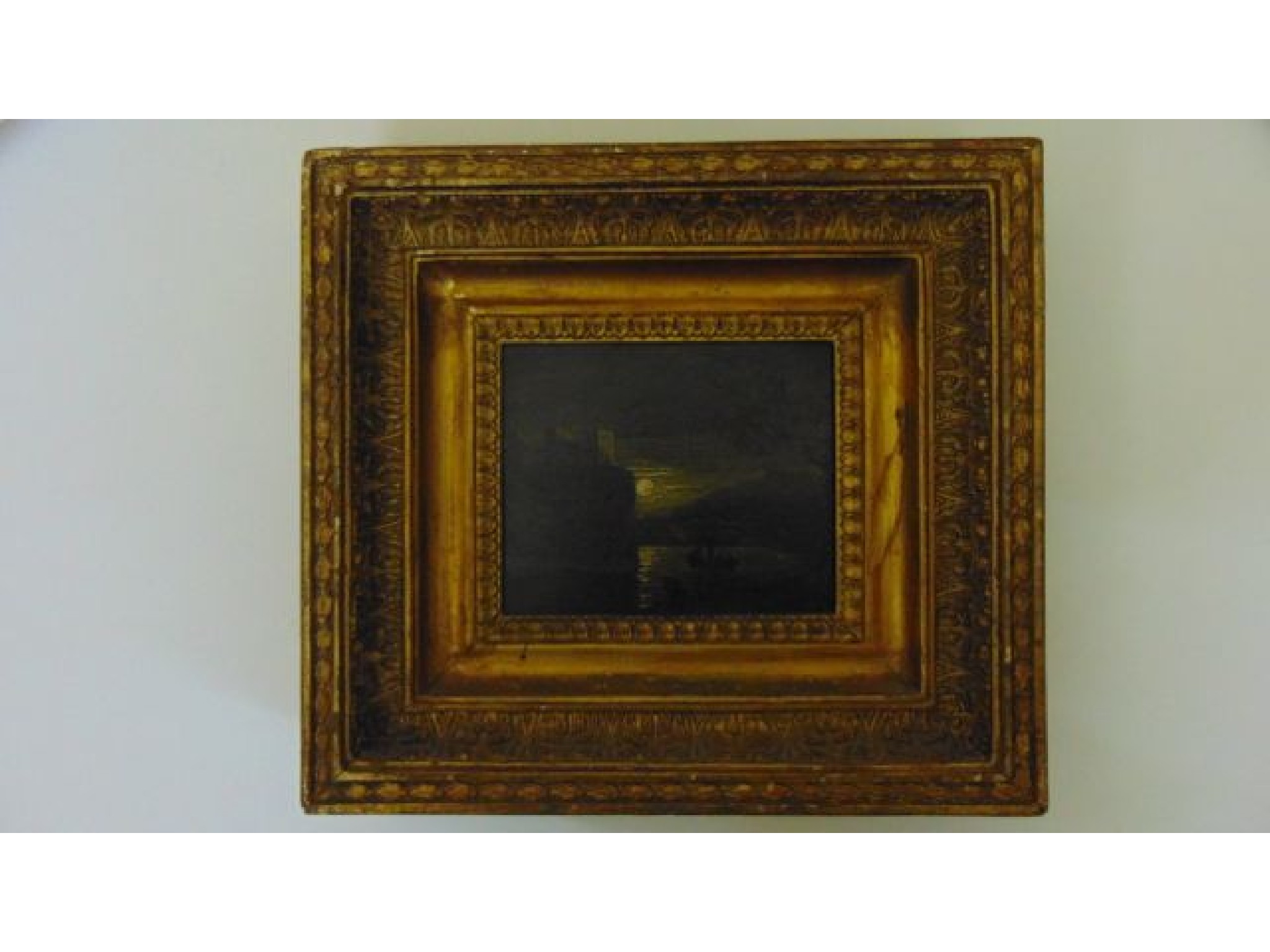 Appraisal: A small th century oil on panel showing a moonlit