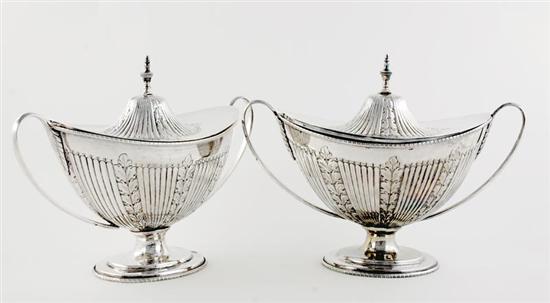 Appraisal: Pair International silverplate covered tureens urn-form finial atop ovoid domed