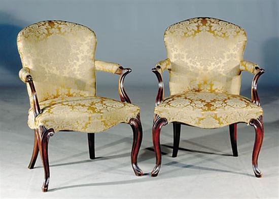 Appraisal: Pair George II style carved mahogany armchairs th centuryarched and