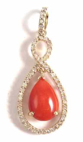 Appraisal: CORAL DIAMOND AND FOURTEEN KARAT GOLD PENDANT round-cut diamonds are