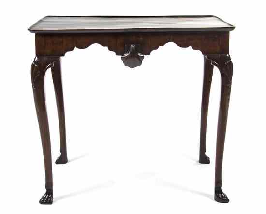 Appraisal: A George II Mahogany Dish-Top Tea Table having a carved