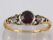 Appraisal: A garnet and rose cut diamond ring with a carved