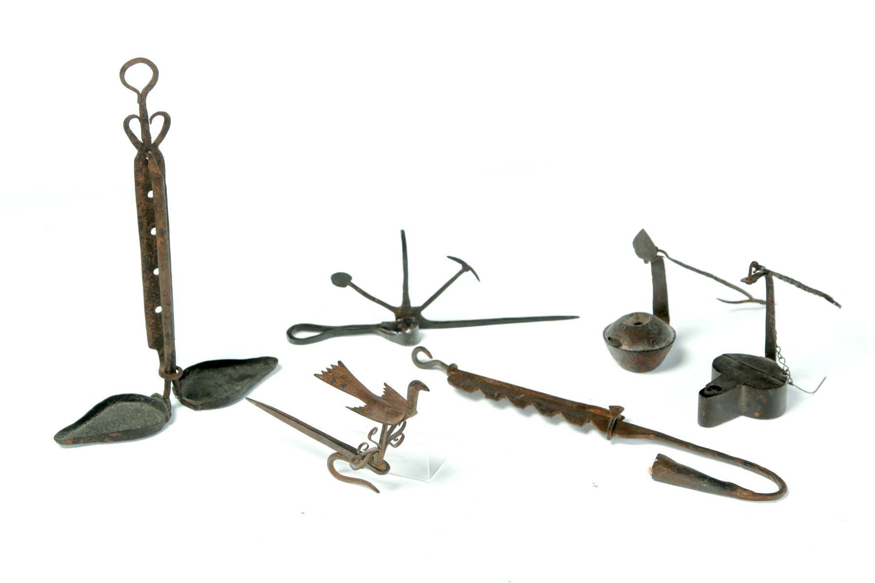 Appraisal: SIX AMERICAN WROUGHT IRON LIGHTING DEVICES Nineteenth- th century Two