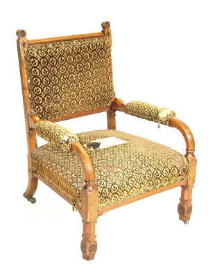 Appraisal: An oak Gothic Revival open armchair the upholstered back and