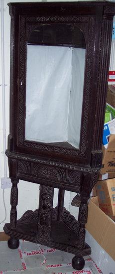 Appraisal: A th Century carved oak free standing corner cabinet the