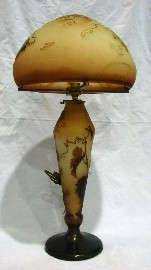 Appraisal: A Galle style cameo glass lamp and shade profusely modelled