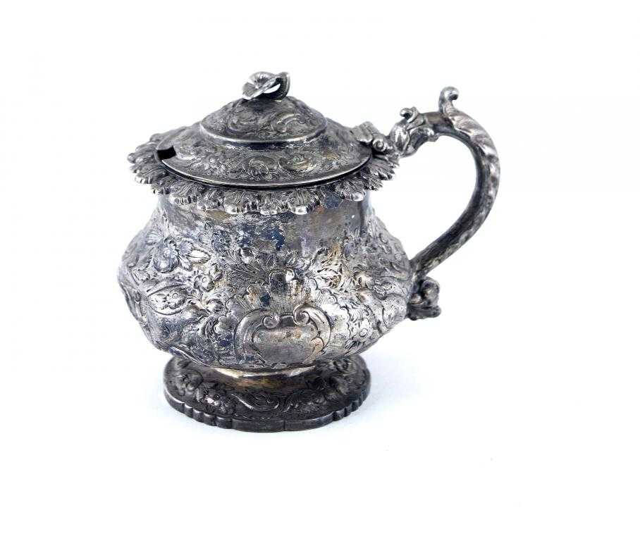 Appraisal: A GEORGE IV MUSTARD POT compressed circular with applied leaf