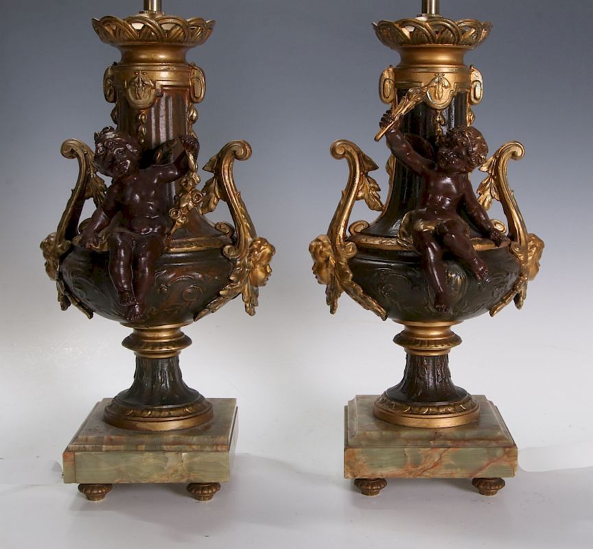 Appraisal: A PAIR GILT PATINATED SPELTER URN CHERUB LAMPS Circa spelter