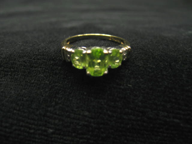 Appraisal: Peridot Diamond Ring three rich green gems and four small