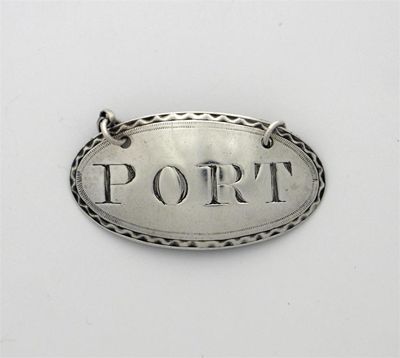 Appraisal: A George III bright cut oval wine label PORT maker's