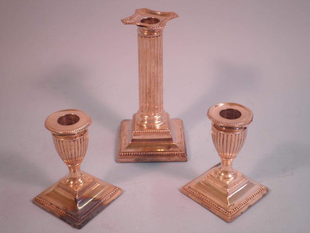 Appraisal: A silver candlestick in the form of a Corinthian column