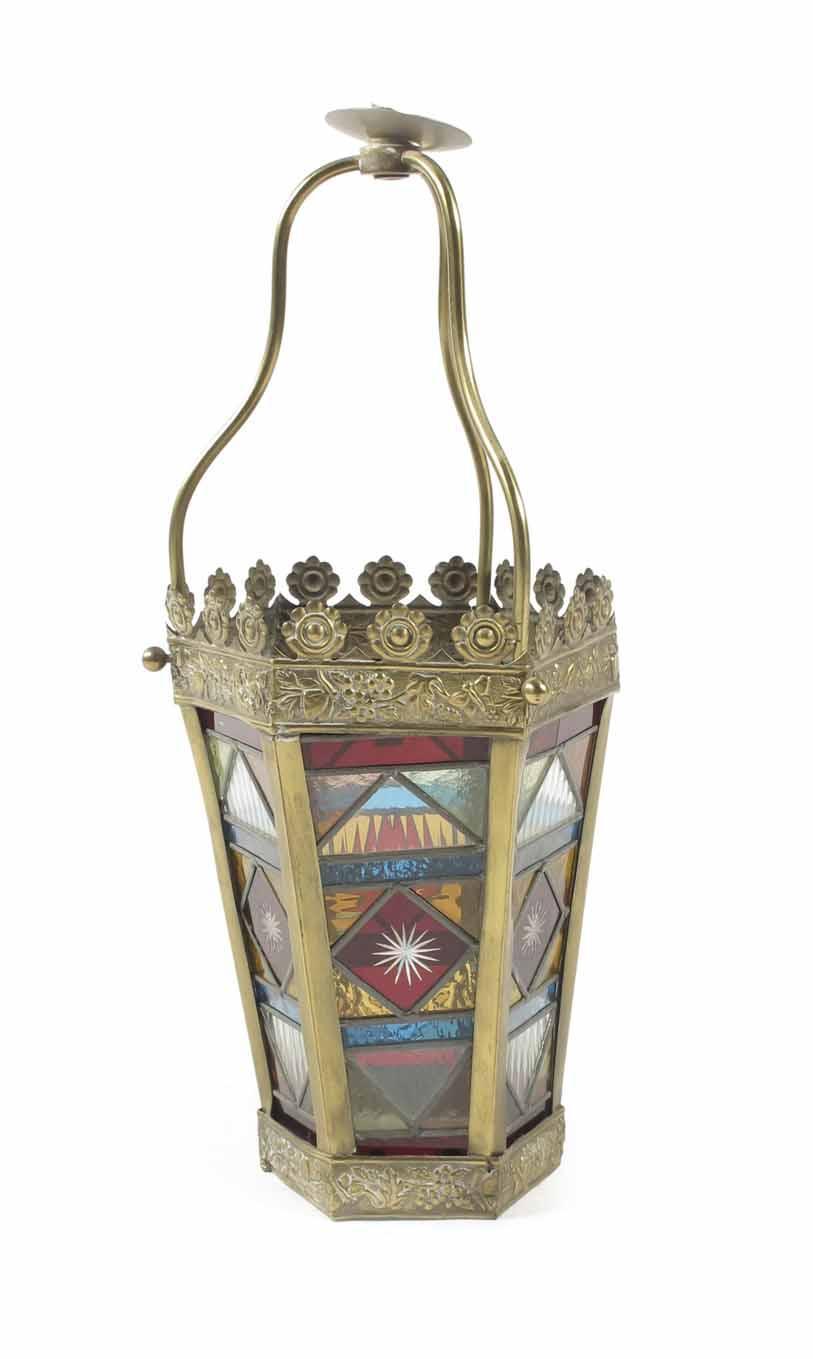 Appraisal: A late Victorian stamped brass and stained glass hall lantern