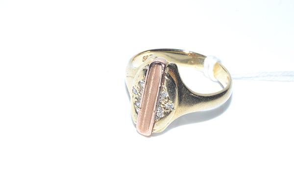 Appraisal: A DIAMOND SET TWO TONE GOLD SIGNET RING IN CT