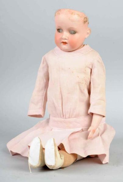 Appraisal: Doll in Pink Dress Description German Signed Armand Marseille and