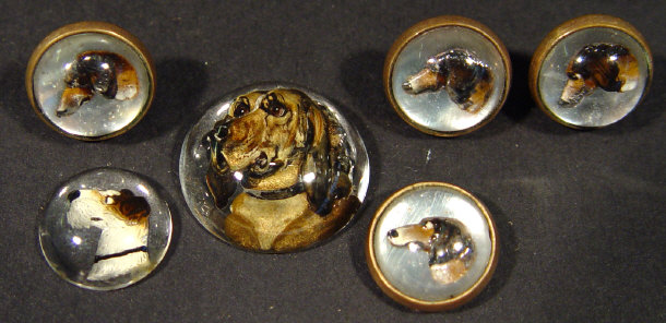 Appraisal: Set of four matching dog design buttons and two larger