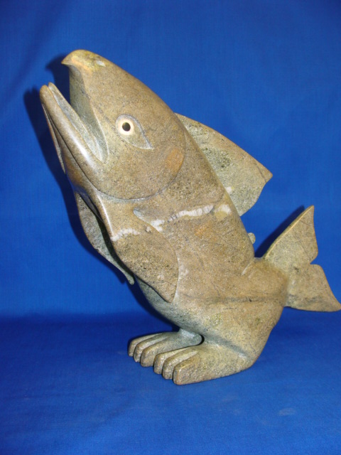 Appraisal: INUIT ARTIST A mottled green transformation figure of a fish