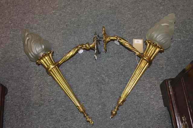 Appraisal: A PAIR OF GILT METAL CLASSICAL STYLE WALL LIGHTS each