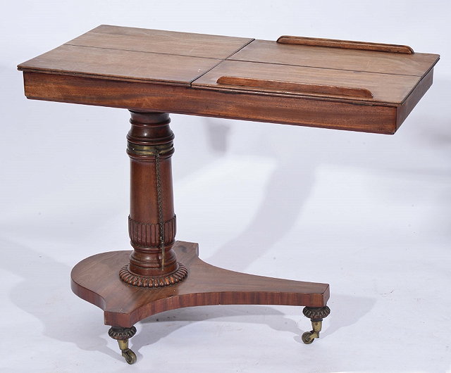 Appraisal: A WILLIAM IV CARVED MAHOGANY ADJUSTABLE READING TABLE with rectangular