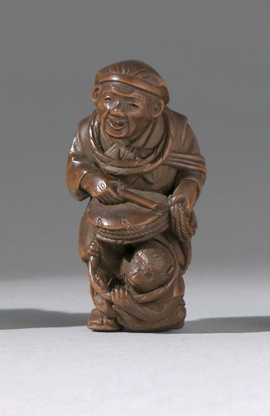 Appraisal: WOOD NETSUKE Late th Early th CenturyIn the form of