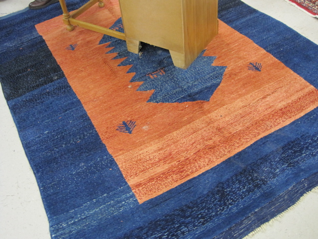 Appraisal: TURKISH GABBEH CARPET plain blue and salmon ground hand knotted