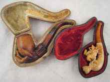 Appraisal: A meerschaum pipe formed as a hand supporting the bowl