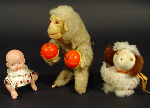 Appraisal: Three children's clockwork toys - a monkey playing maraccas a