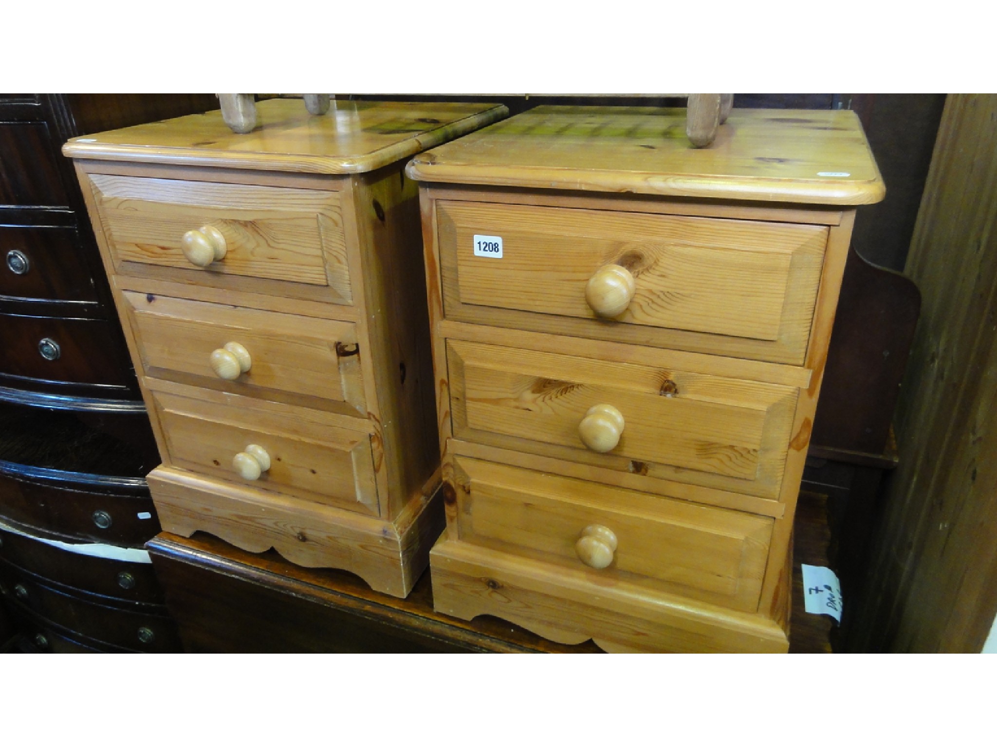 Appraisal: A pair of solid stripped pine three drawer bedside chests