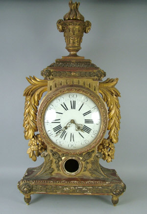 Appraisal: A Louis XVI style profusely carved and giltwood bracket clock