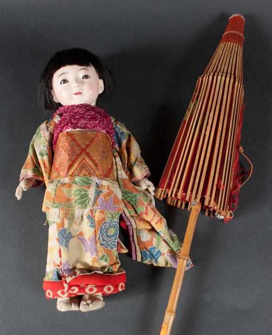 Appraisal: Japanese painted composition doll with inset glass eyes and a