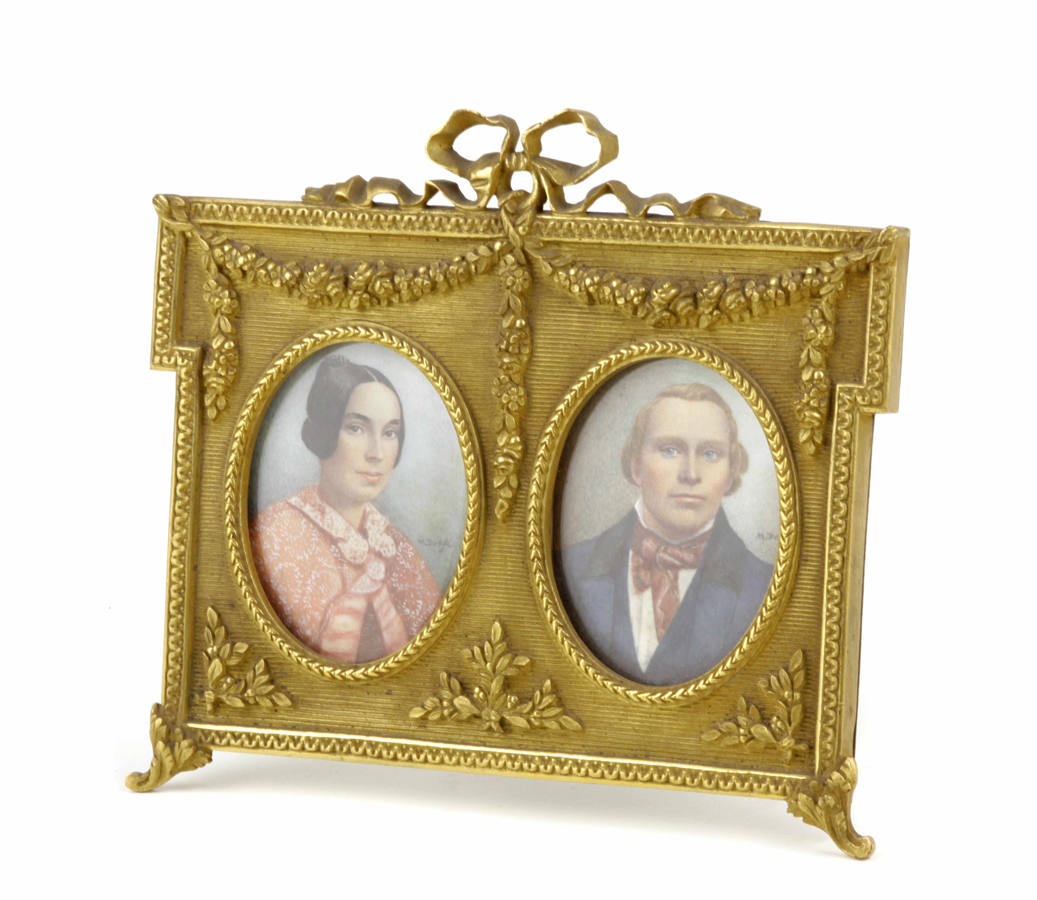 Appraisal: A Louis XVI style gilt bronze dual aperture frame Displaying