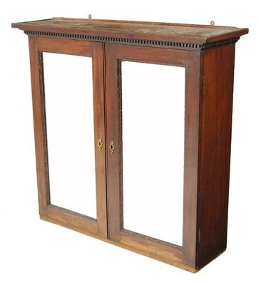 Appraisal: A George II mahogany cabinet the dentil cornice above a