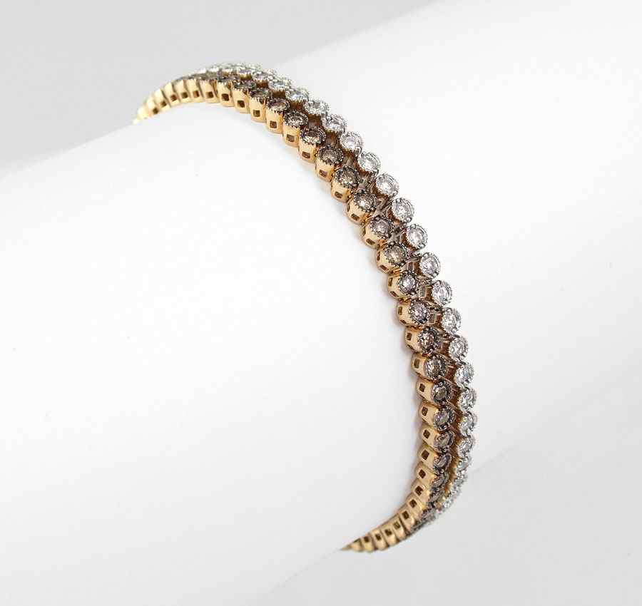 Appraisal: SIGNED DESIGNER TWO STRAND K DIAMOND BRACELET K yellow and