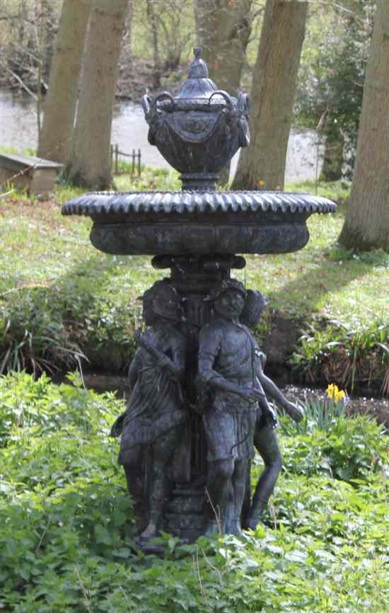 Appraisal: A modern bronze garden fountain with urn surmount and classical