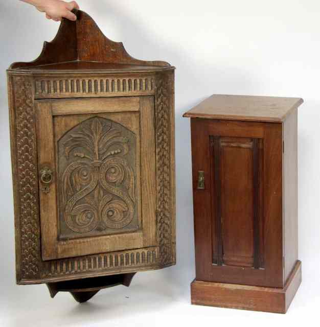 Appraisal: A corner cupboard with carved door and a bedside table