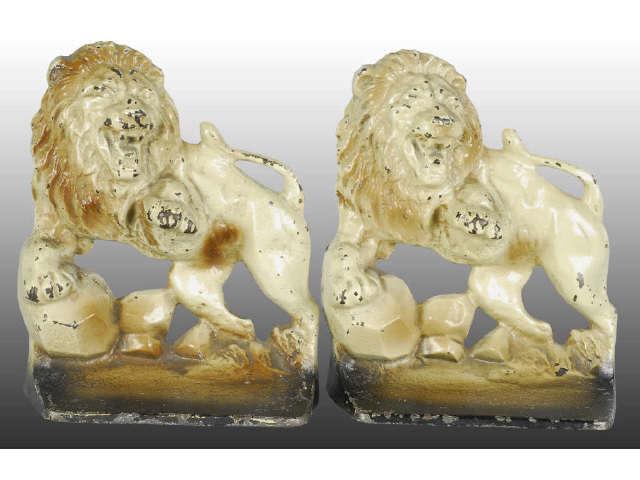 Appraisal: Lion on Rocks Cast Iron Bookends Description Creations Co Copyright