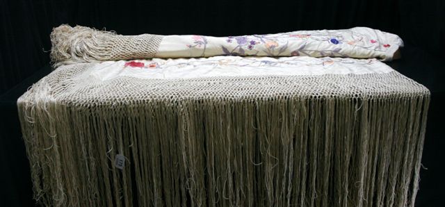 Appraisal: A Victorian cream silk floral embroidered shawl with deep fringe