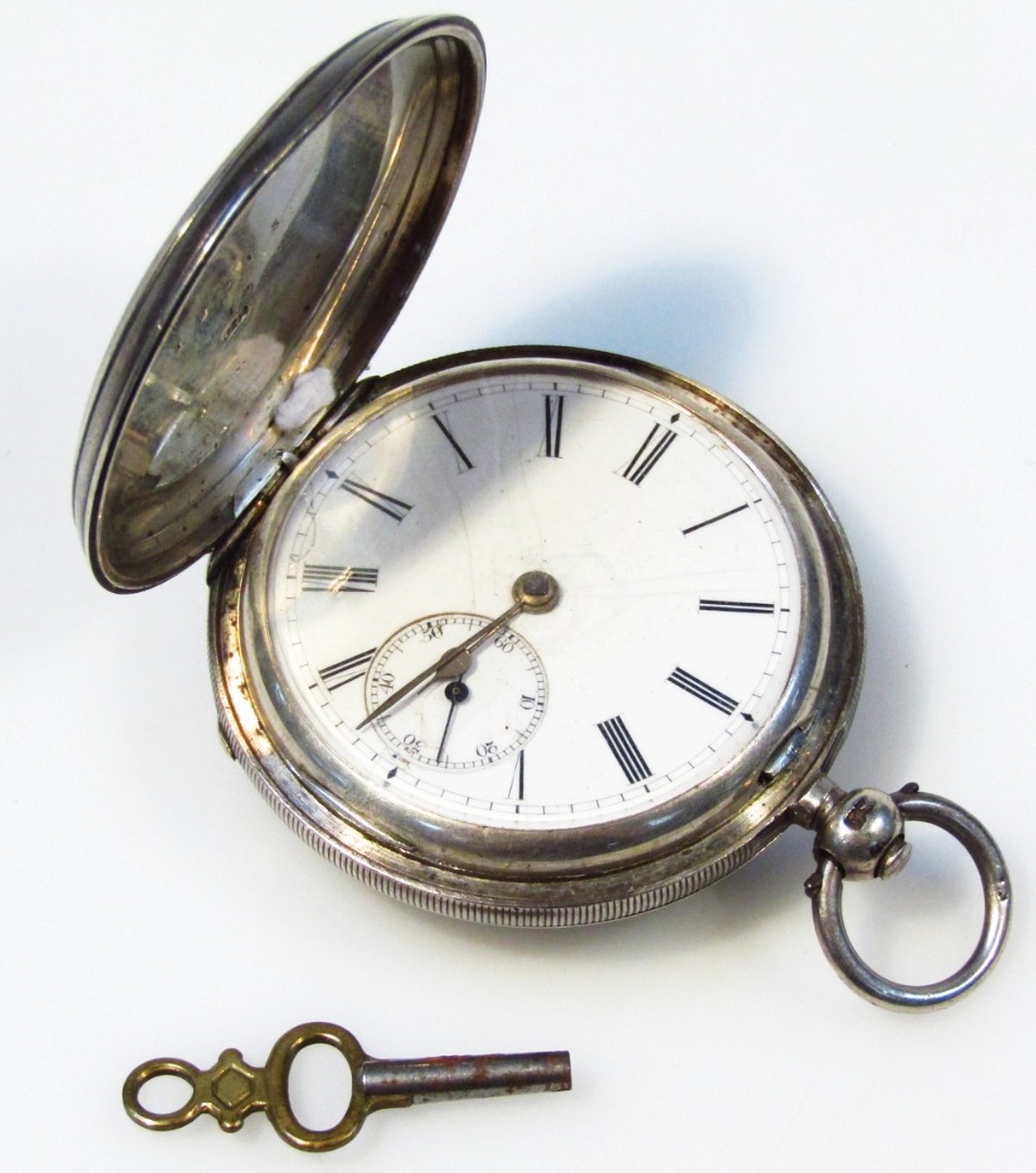 Appraisal: A Victorian silver hunter pocket watch the engine turned case