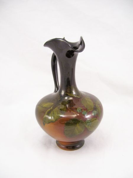 Appraisal: Rookwood Ewer Dark brown glaze with a hand painted berry