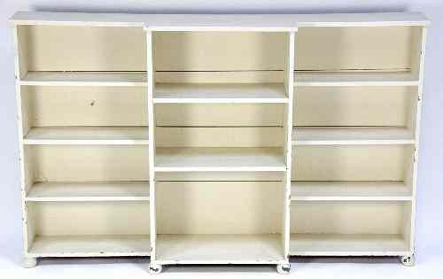 Appraisal: A white painted breakfront bookcase on ball feet cm wide