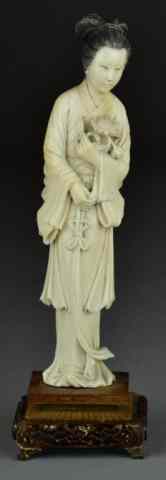 Appraisal: Chinese Carved Ivory BeautyFinely carved her holding a bouquet of