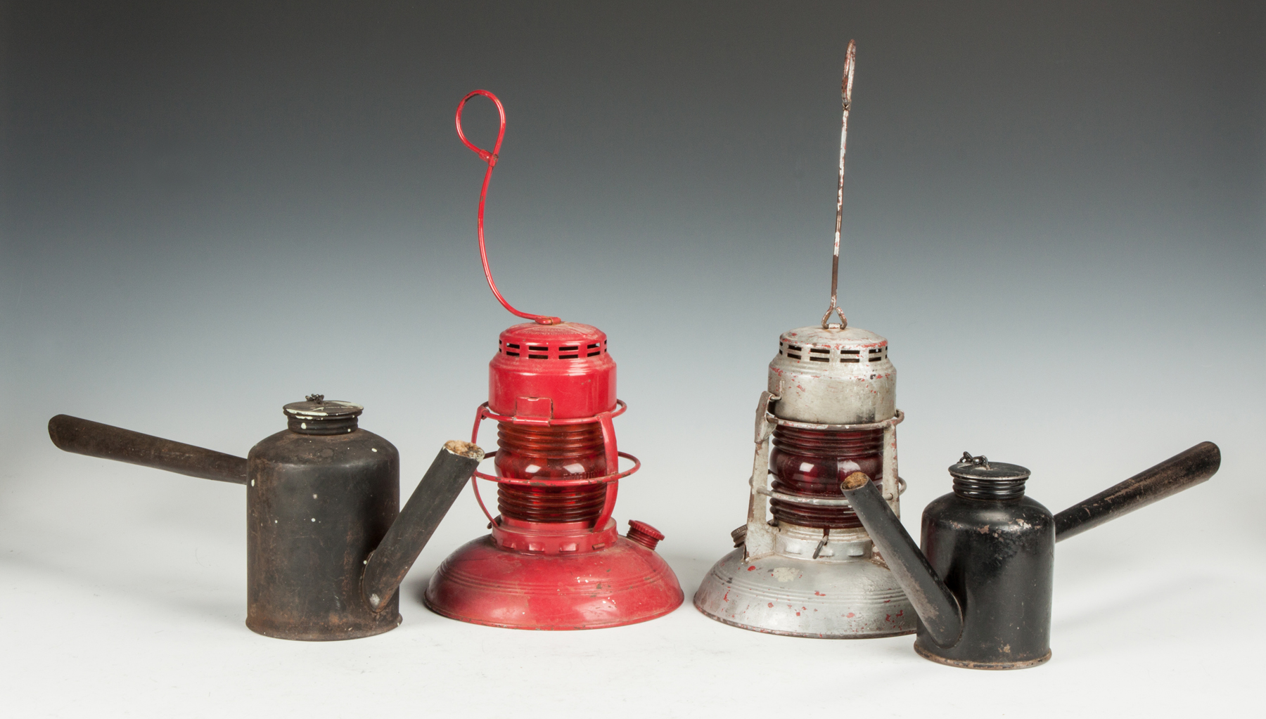 Appraisal: Four Oil Lamps Lanterns Two Embury Warsaw NY Railroad lamps