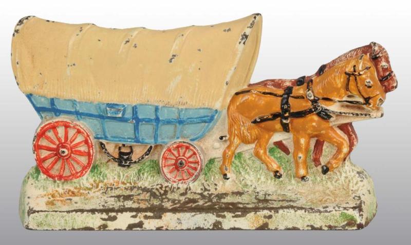 Appraisal: Covered Wagon with Team of Horses Doorstop Description Cast iron