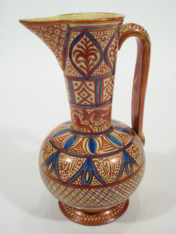 Appraisal: th Century Islamic style pottery ewer with copper and blue