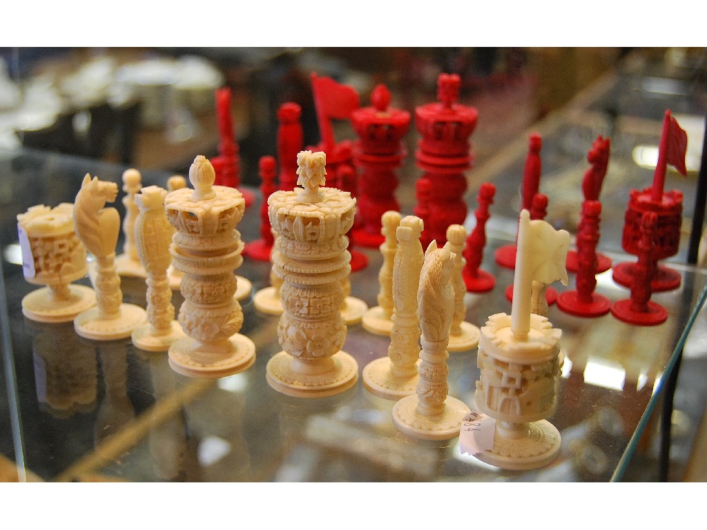 Appraisal: A set of Chinese carved ivory chessmen three white pawns