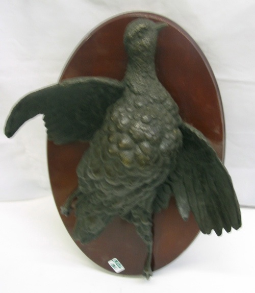 Appraisal: THREE BRONZE SCULPTURES OF BIRDS mounted as wall plaques on