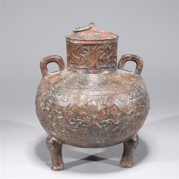 Appraisal: Chinese archaistic bronze covered tripod censer with molded handles and